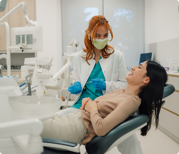 Woman receiving dental care, smiling