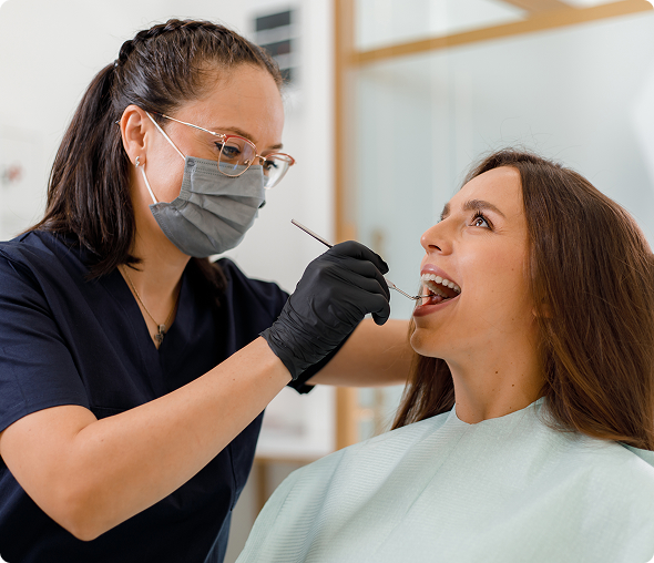 Dentist examining patient's teeth